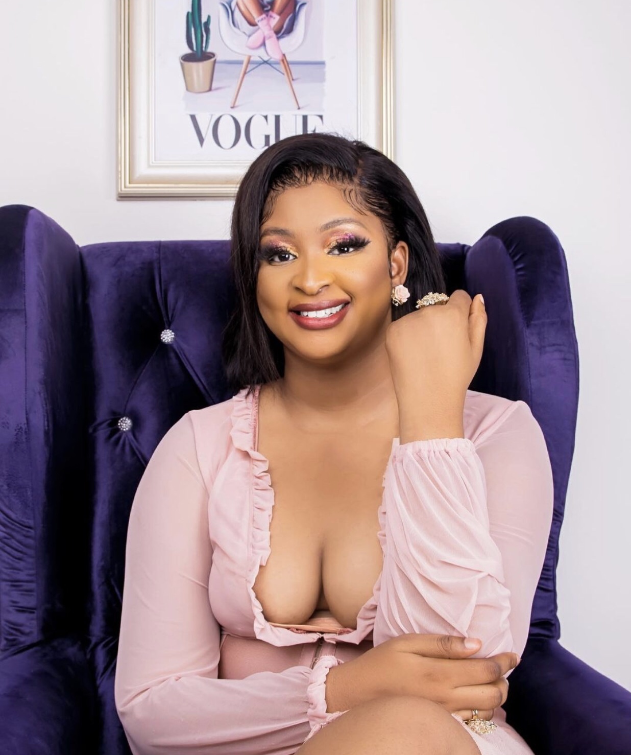 Fan blast Etinosa over cleavage baring outfit