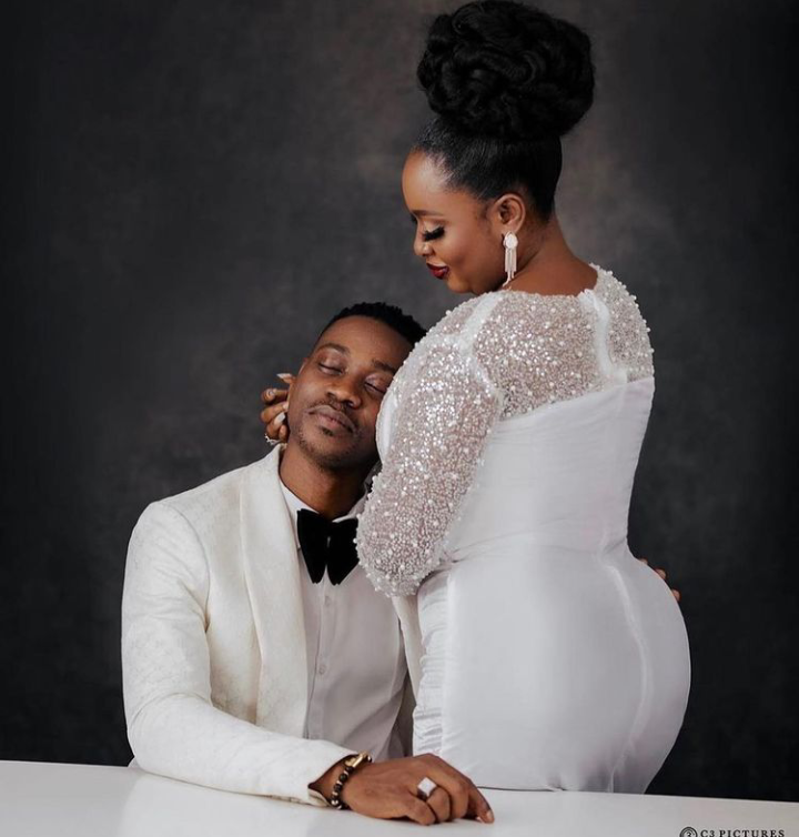 “She’s a good wife” – Fans Praise Actress Mo Bimpe As She Knee Down To Present Her Birthday Gift To Her Husband Lateef Adedimeji On His Birthday (Video)