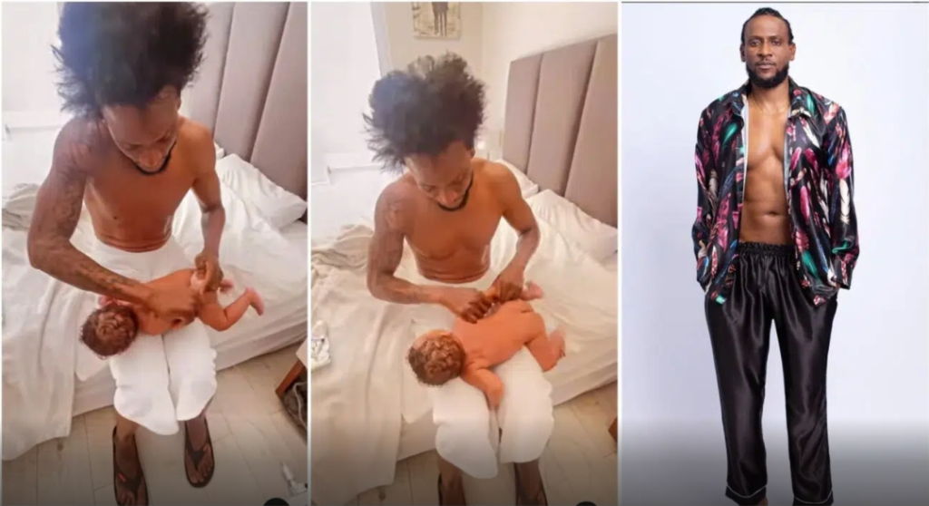 ‘Don’t break his hand’ Fans express concern as BBNaija’s Omshola massages his 3-month-old baby