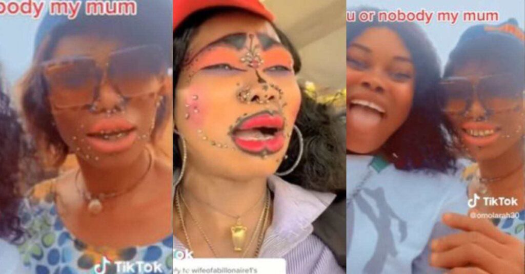 “She come resemble lord of the rings” – Video of Nigerian mom with all her face piercings and excess makeup causes stirs online (Watch)