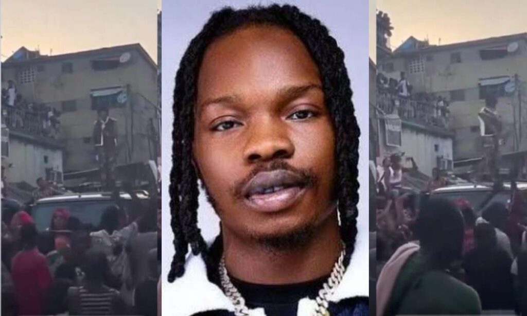 Lagosians take to the street to show love to Naira Marley as he shoots new music video amid cancelation (Video)