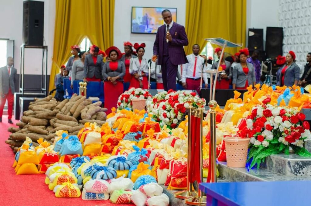 "A Beautiful Sunday to remember” – Pastor shares bags of rice and yams to members after church service (Photos)